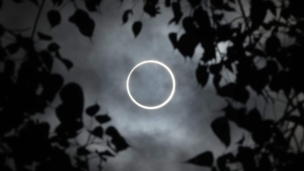 The moon totally covers the sun in a rare "ring of fire" solar eclipse as seen from the south Indian city of Dindigul.