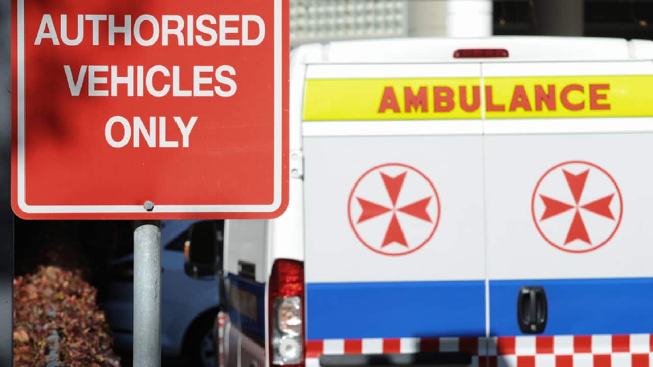 Ambulances parked in the emergency bay at a hospital