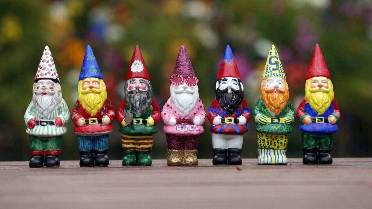 Gnomes designed by various celebrities including Elton John's (centre) on display at the RHS Chelsea Flower Show, London.. Picture date: Monday May 20, 2013. See PA story CONSUMER Chelsea. Photo credit should read: Jonathan Brady/PA Wire