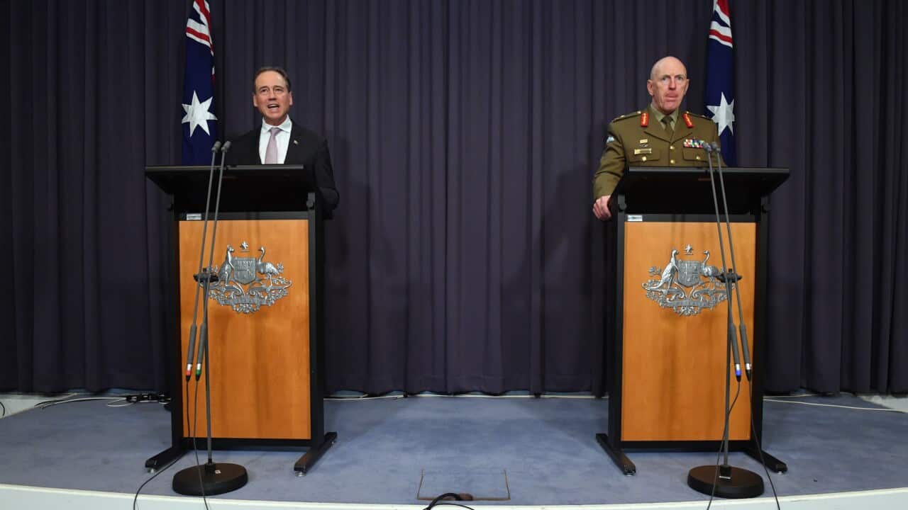 Minister for Health Greg Hunt and COVID-19 Taskforce Commander, Lieutenant General John Frewen at a press conference at Parliament House in Canberra, Sunday, October 24, 2021. (AAP Image/Mick Tsikas) NO ARCHIVING