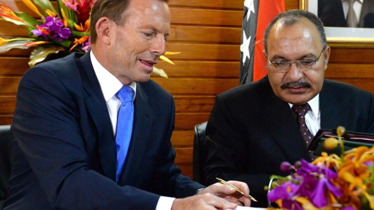 PM Tony Abbott and Papua New Guinea Minister Peter O'Neill.