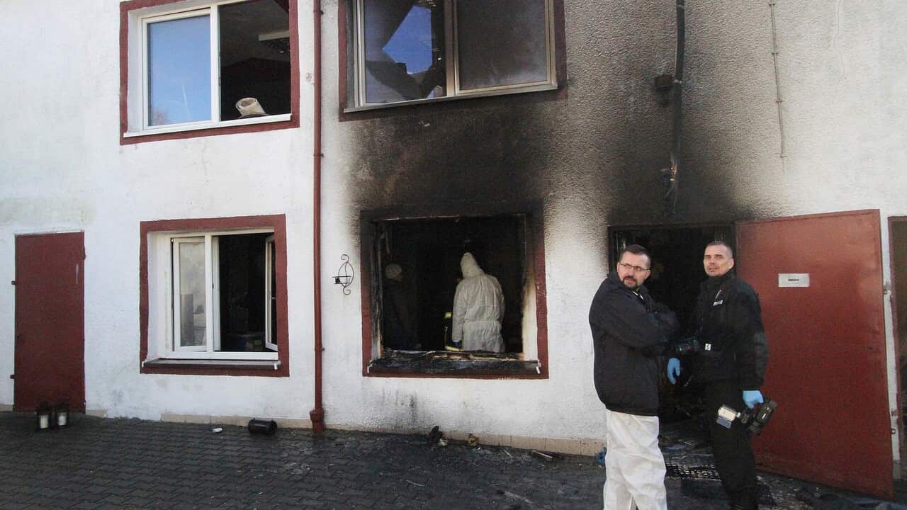 Forensic and other police experts examine the site of a fire in an Escape Room, in Koszalin, northern Poland.