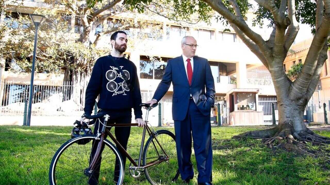 Luke Foley with food delivery worker Kirby Weller.