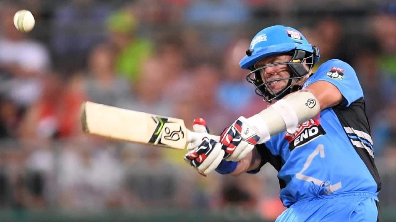 Brad Hodge of the Strikers hits a shot