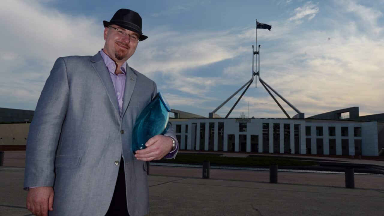 Australia's Local Hero 2014 Tim Conolan posing for photos
