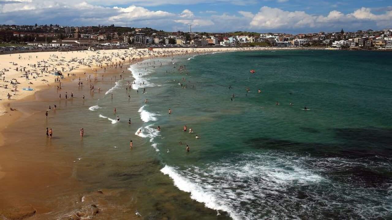 Beachgoers gather at Bondi Beach, Sydney, Saturday, January 13, 2018. (AAP Image/Jeremy Ng) NO ARCHIVING
