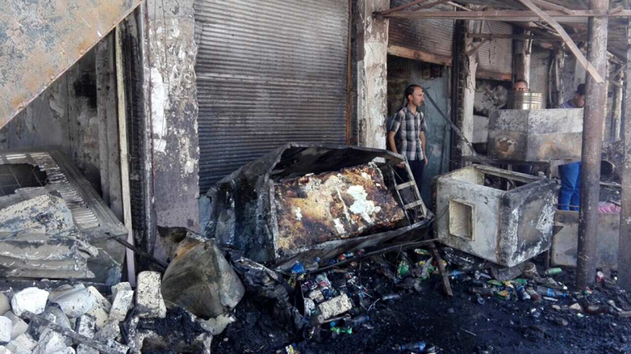 A man near the scene of suicide attack outside Imam Mohammed shrine