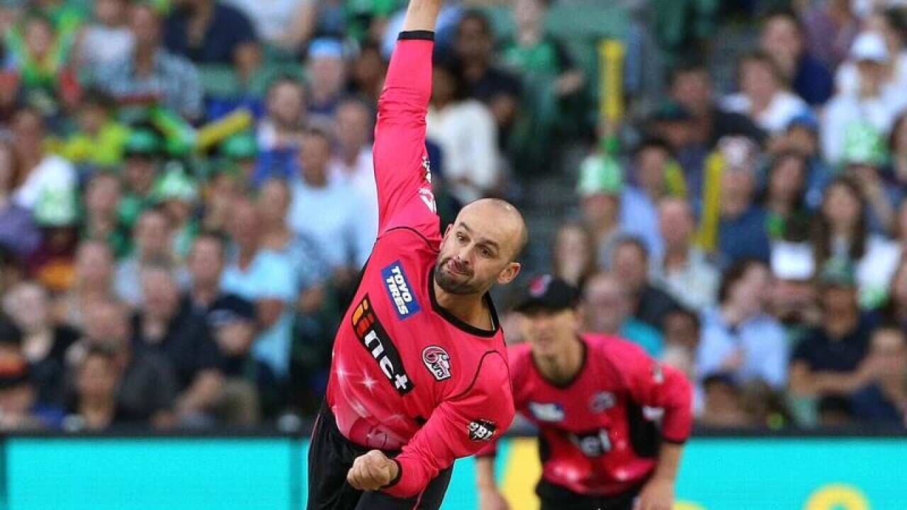 Nathan Lyon of the Sydney Sixers bowling