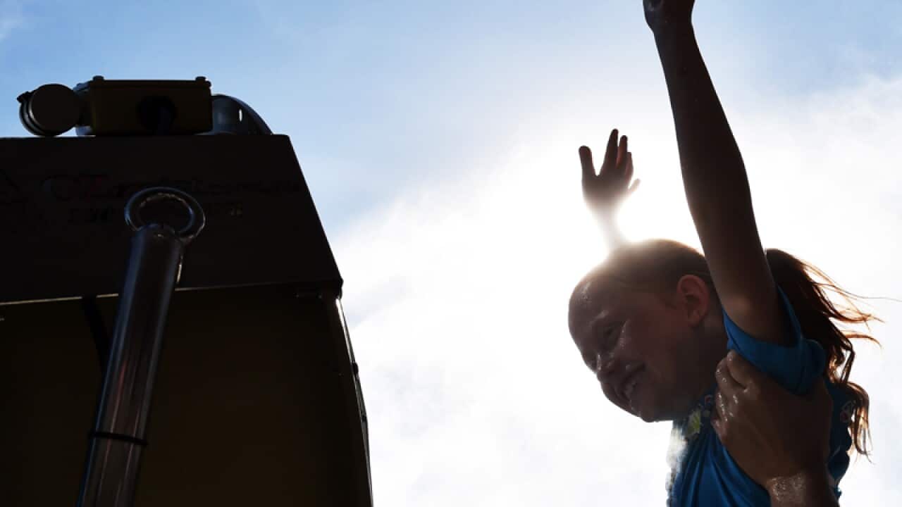 A child cools off during the Australian Open tennis tournament