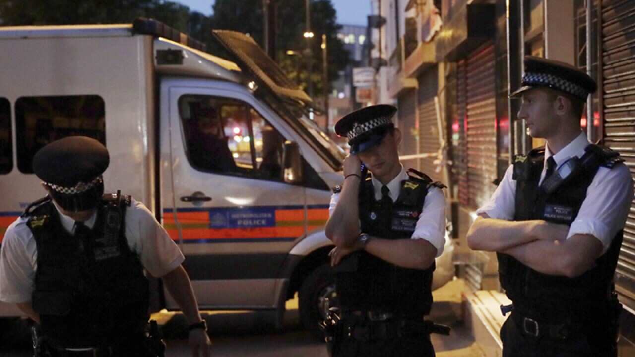 Emergency services stand near Finsbury Park in London