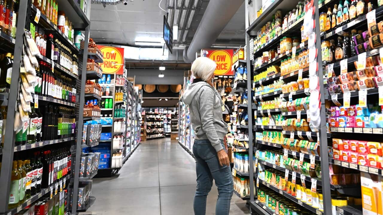 A woman is seen shopping at a supermarket in Canberra.