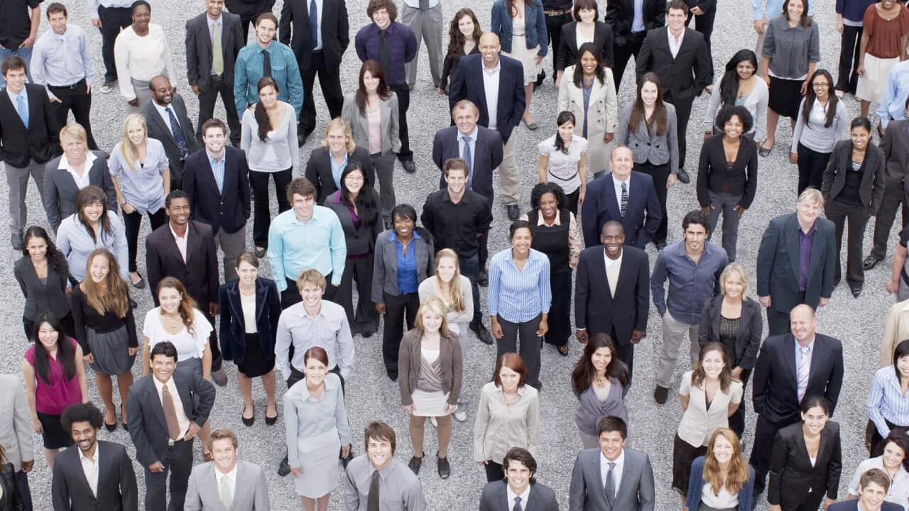Portrait of business people in crowd
