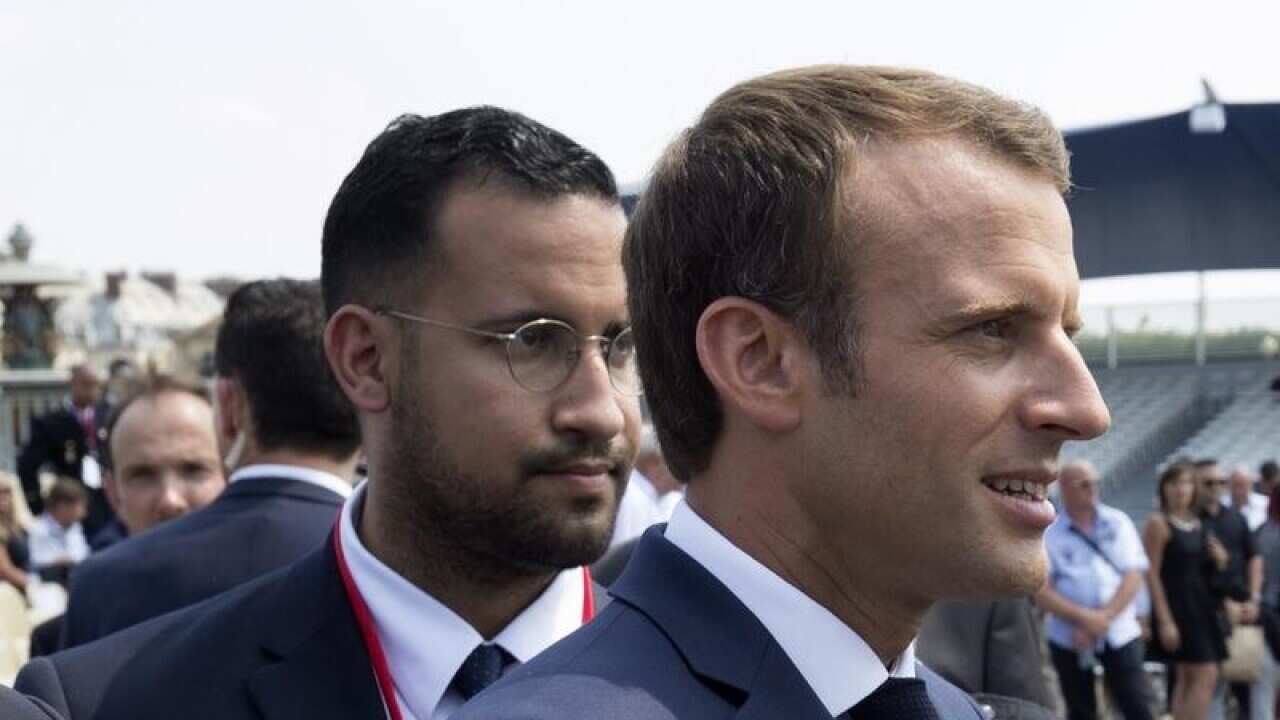 Alexandre Benalla and French President Emmanuel Macron.