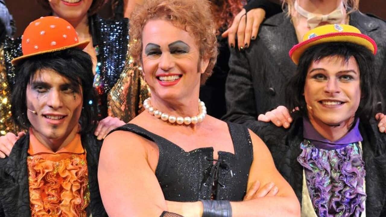 Craig McLachlan (C) poses with Rocky Horror cast members