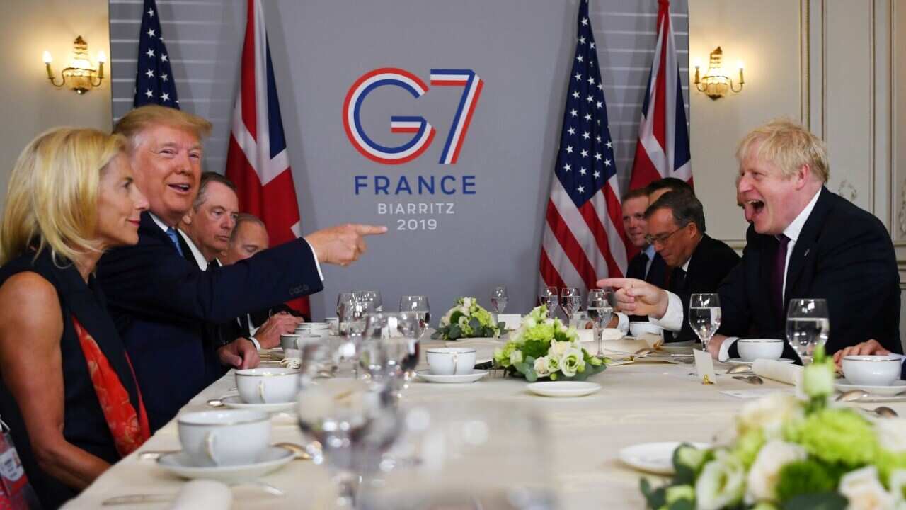 US President Donald J. Trump (2-L) and Britain's Prime Minister Boris Johnson (R) hold a bilateral meeting during the G7 summit in Biarritz, France, 25 August 2019. 