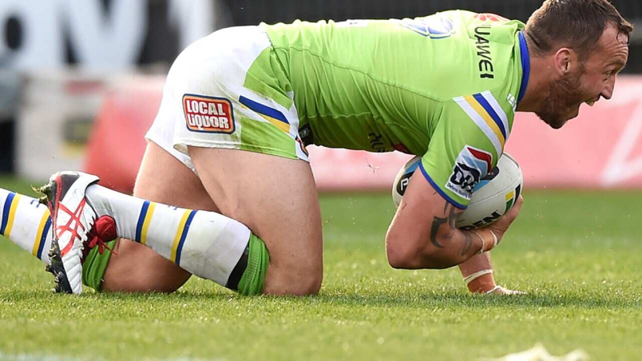 Josh Hodgson of the Raiders celebrates after scoring a try