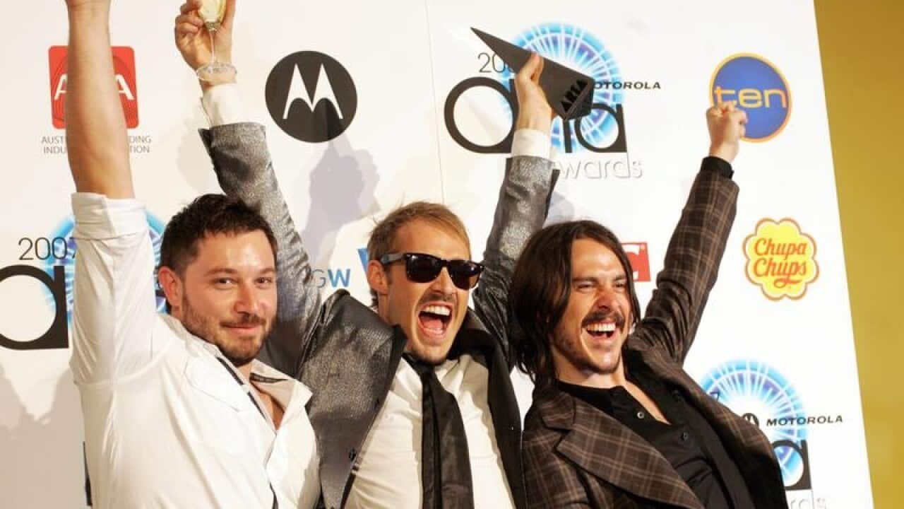 Chris Joannou with Silverchair bandmates Daniel Johns and Ben Gillies.