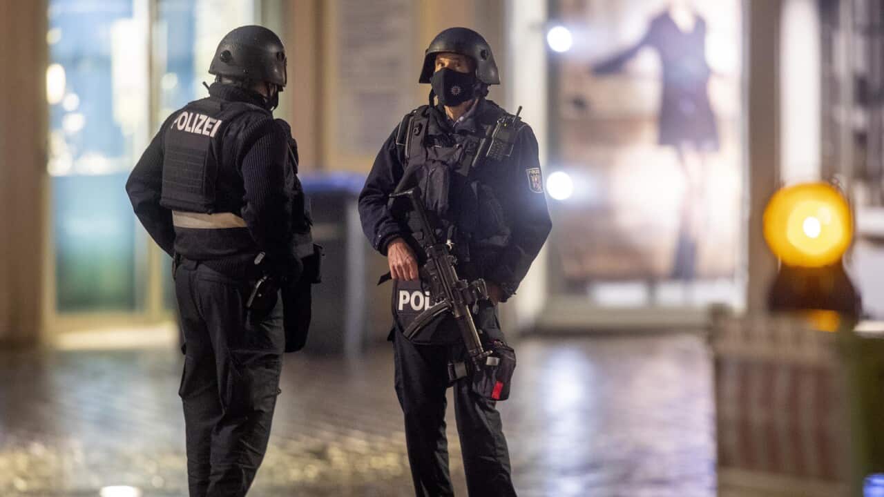 Police officers guard evidence at the scene of an incident in Trier, Germany, Tuesday, 1 December, 2020. 