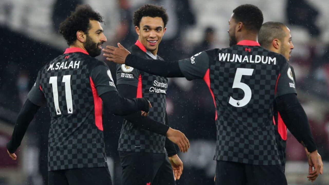 Mohamed Salah celebrates a goal with his Liverpool teammates