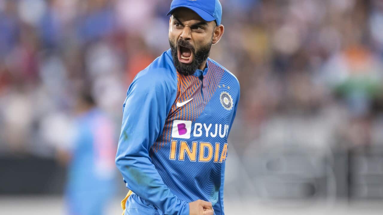 Indian captain Virat Kohli reacts to taking the catch to dismiss Martin Guptill from New Zealand during their Twenty/20 cricket international in Auckland, New Zealand, Sunday, Jan. 26, 2020. (Peter Meecham/Photosport via AP)