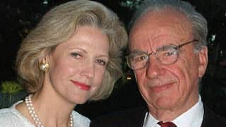 A middle-aged white woman next to an older white man
