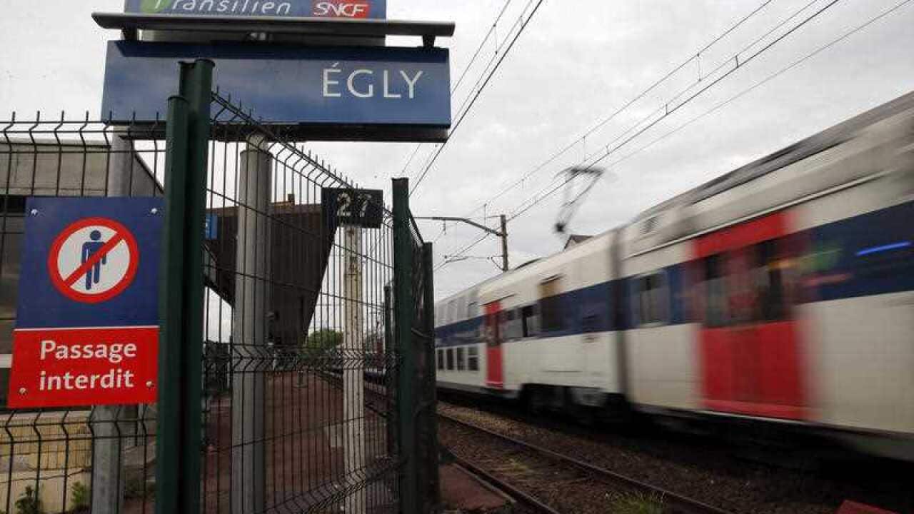 A train starts at the Egly station, south of Paris, Wednesday, May 11, 2016. 