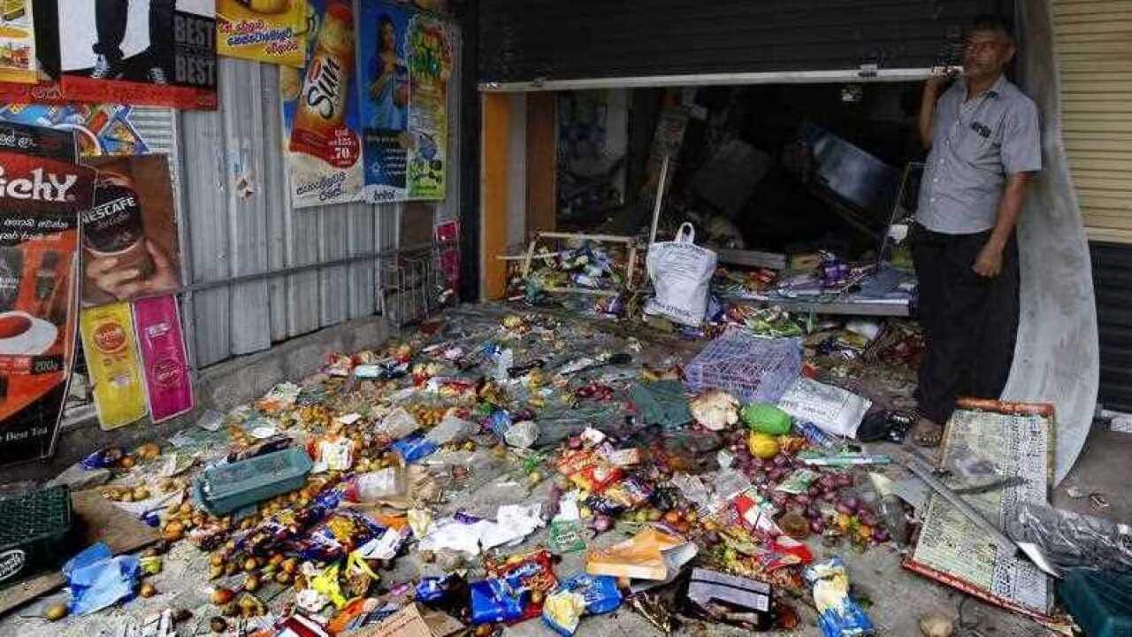 A Sri Lankan Muslim from among the Moor community standing at his business establishment which had been attacked and looted at the Pallekelle town in Kandy 117kms from Colombo,