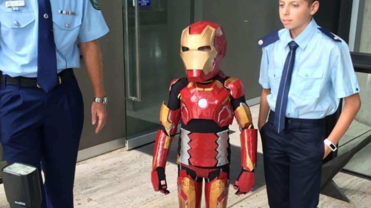 Domenic fully clad in his Iron Boy suit.
