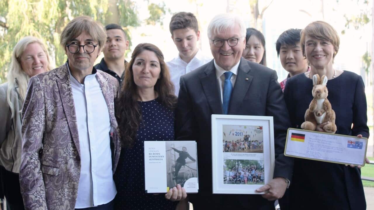 Frank-Walter Steinmeier met members of the German community together with his partner Elke Büdenbender (right)