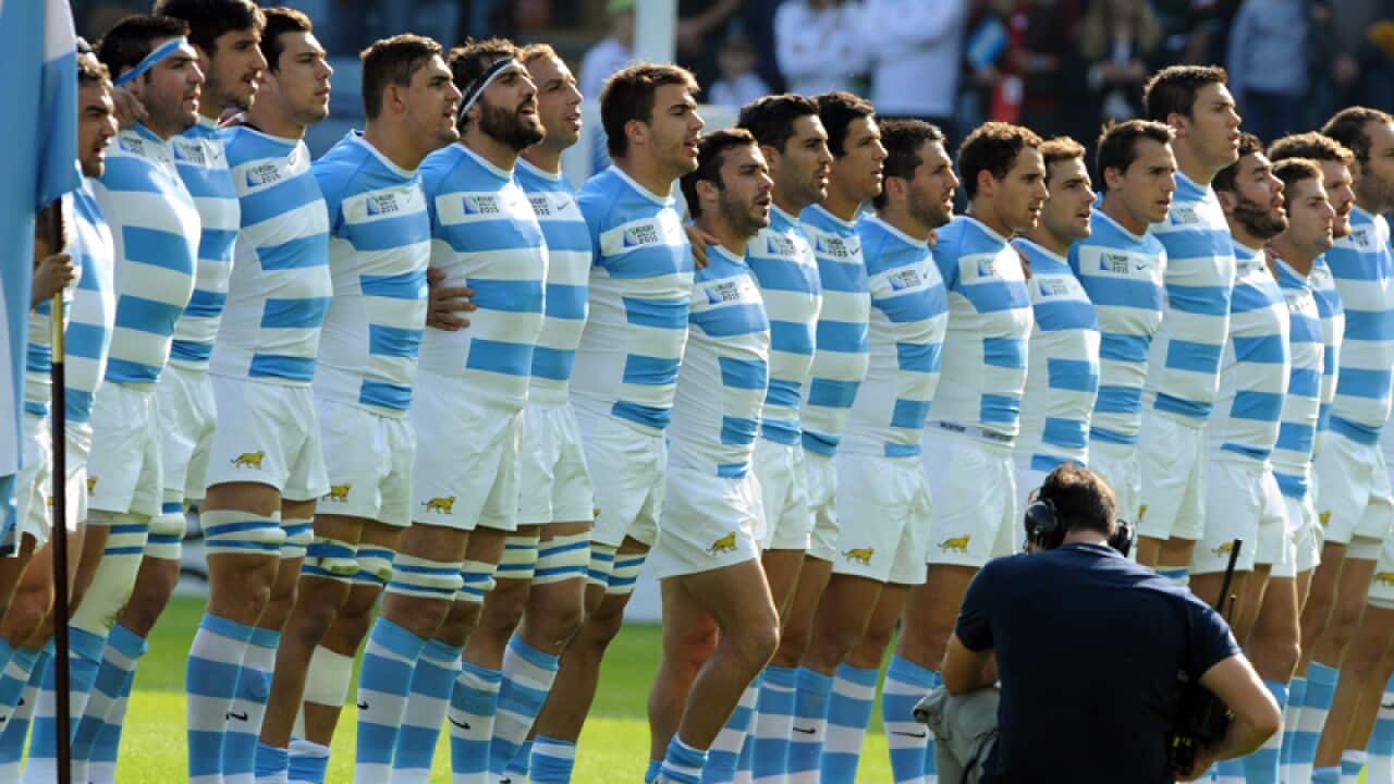 Argentina players listen to their national anthem