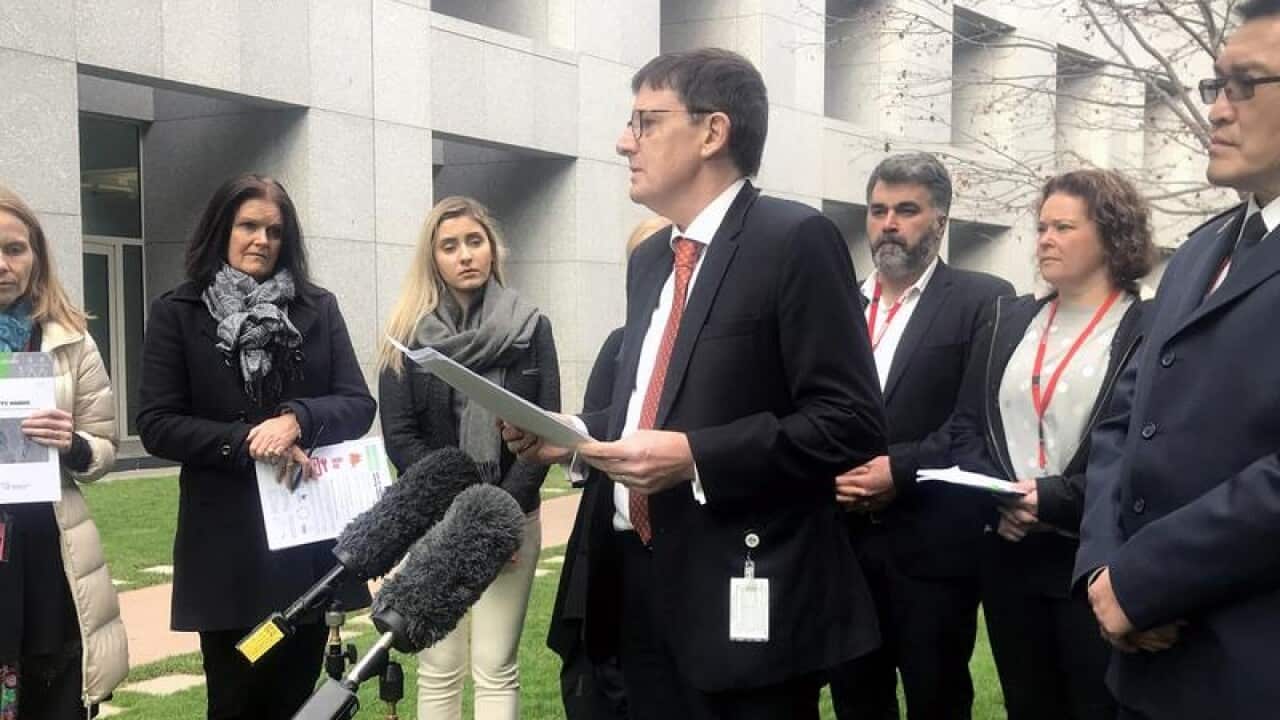 Refugee Council of Australia CEO Paul Power speaking to media.