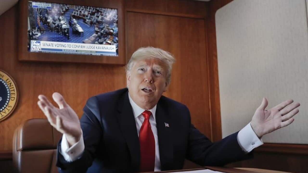 A file image of President Donald Trump on board Air Force One