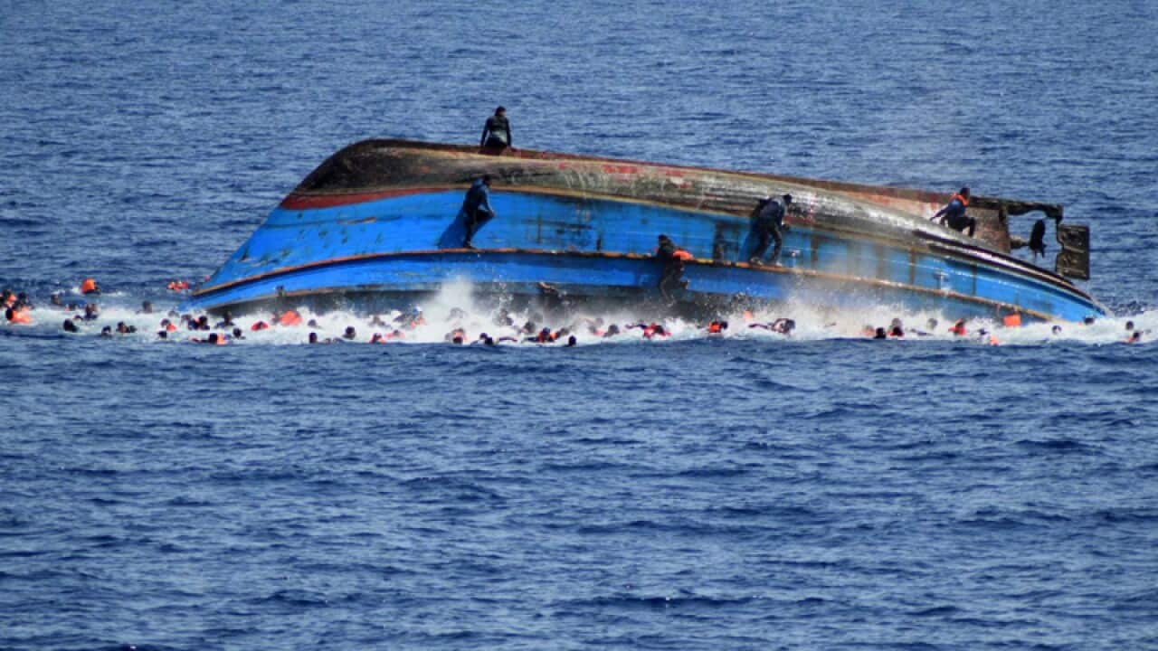 people try to swim away moments after their boat overturned