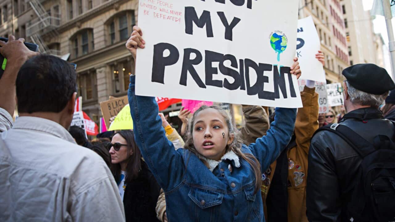 Thousands of protesters march up Fifth Avenue to protest