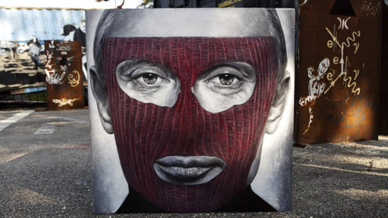 "Pussy Riot - Vladimir Vladimirovich Putin, painted portrait - IMG_2450" by Abode of Chaos is licensed under CC BY 2.0