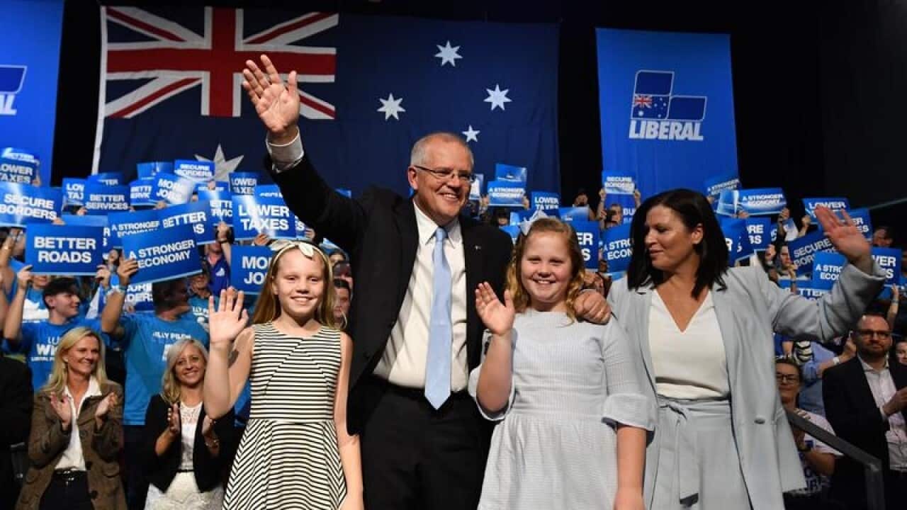 Prime Minister Scott Morrison with daughters Abbey, Lily and wife Jenny at Sunday's campaign rally.