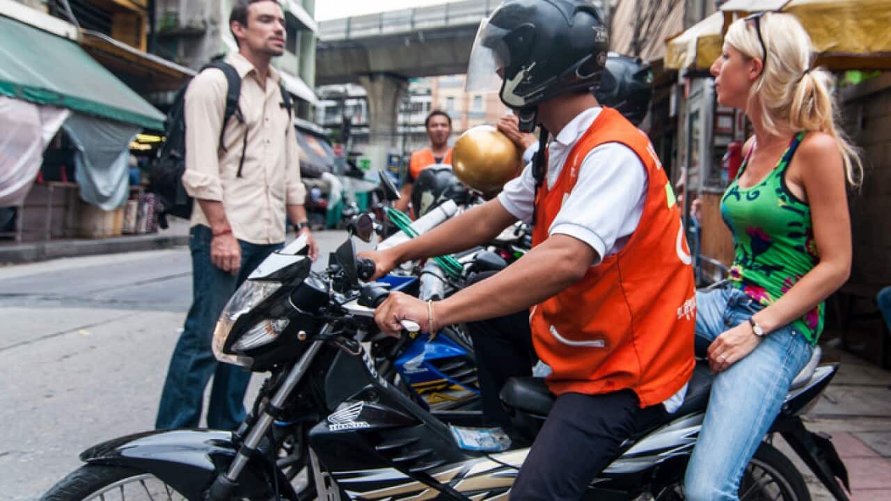 In bangkok, more people, especially women, are becoming motorcycle taxi drivers