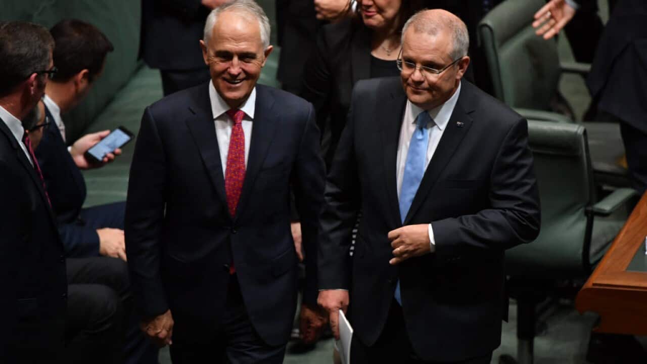Prime Minister Malcolm Turnbull and Treasurer Scott Morrison leave after delivering the 2018 Budget in the House of Representatives.
