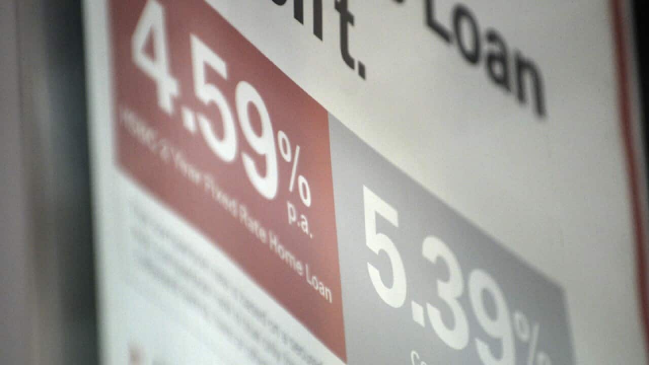 A sign at a bank showing borrowing interest rates in Brisbane