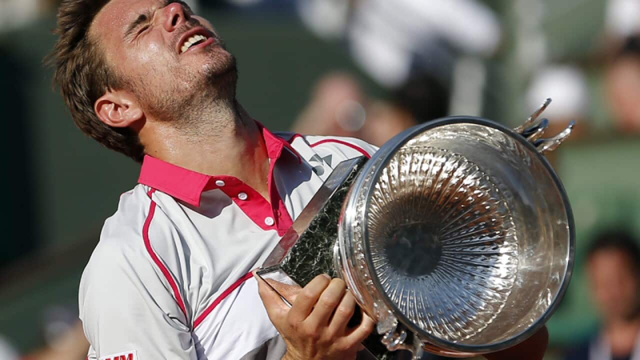Stan Wawrinka of Switzerland poses with the French Open trophy