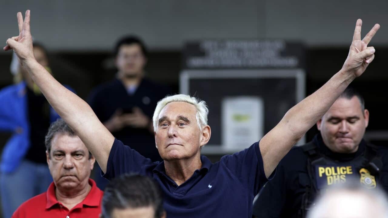 Former campaign adviser for President Donald Trump, Roger Stone walks out of the federal courthouse on Friday. 