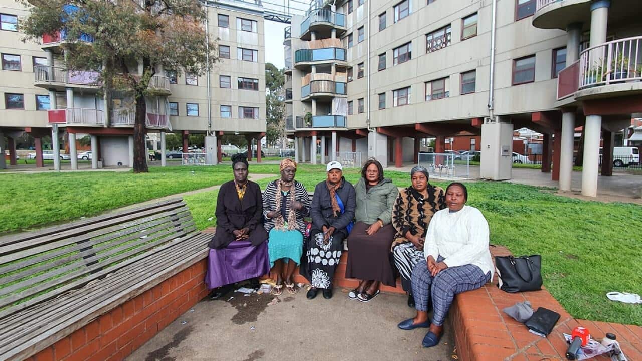 Mothers in a group photo  in-front of the public Housing in Richmond