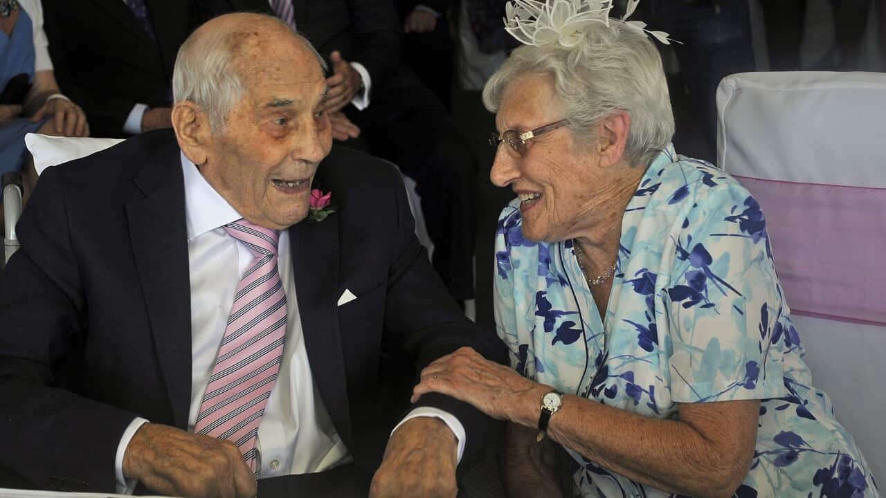 British 103-year old George Kirby (L) chats with his newly married wife, 91-year old Doreen (R), during their wedding party at the Langham Hotel, Eastbourne, East Sussex, Britain, 13 June 2015. (EPA/GERRY PENNY)