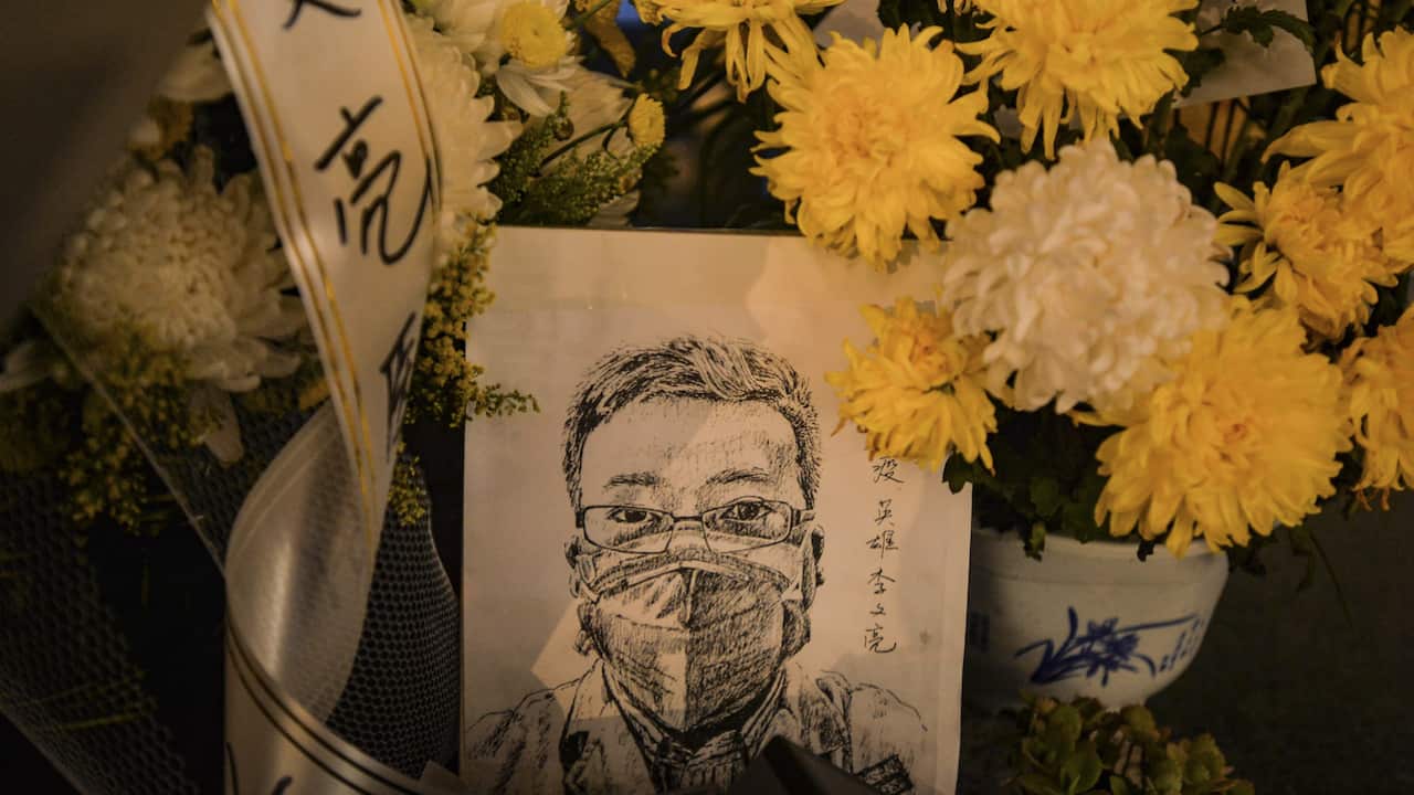 A card with a portrait of Li Wenliang outside a hospital in Wuhan in central China's Hubei province, 7 February 2020