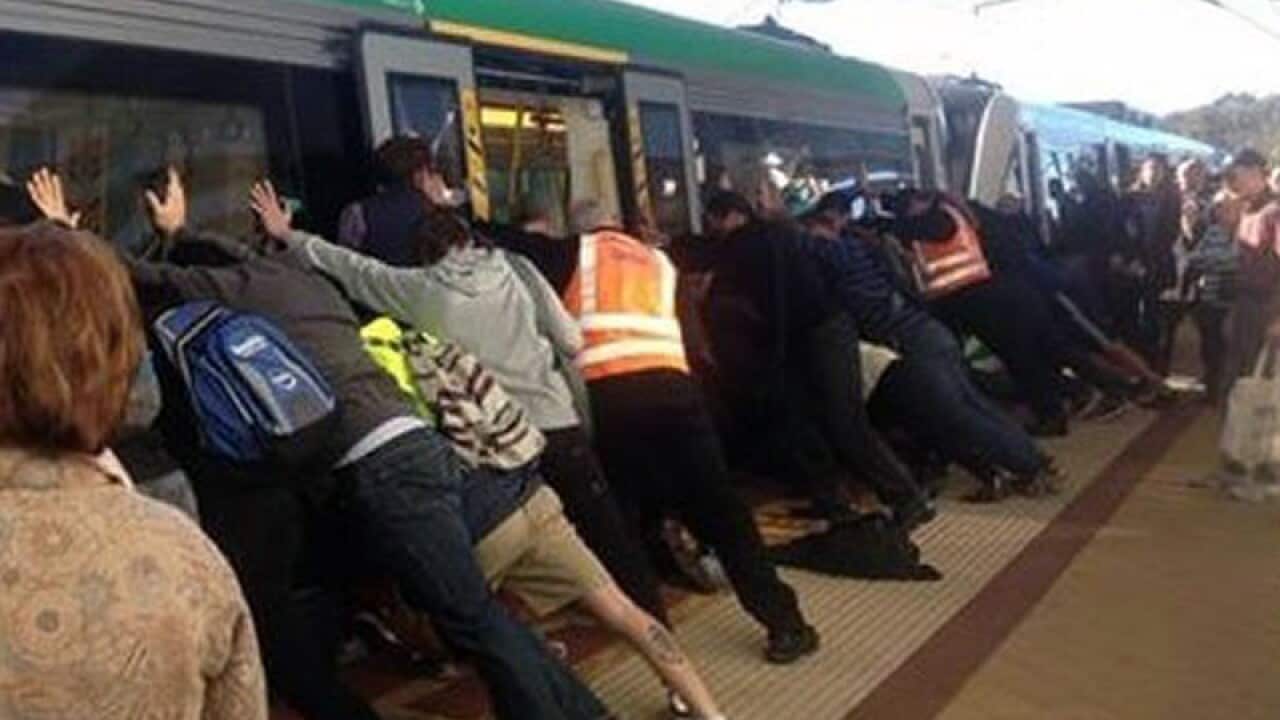 Commuters free a man whose leg was trapped at a Perth train station
