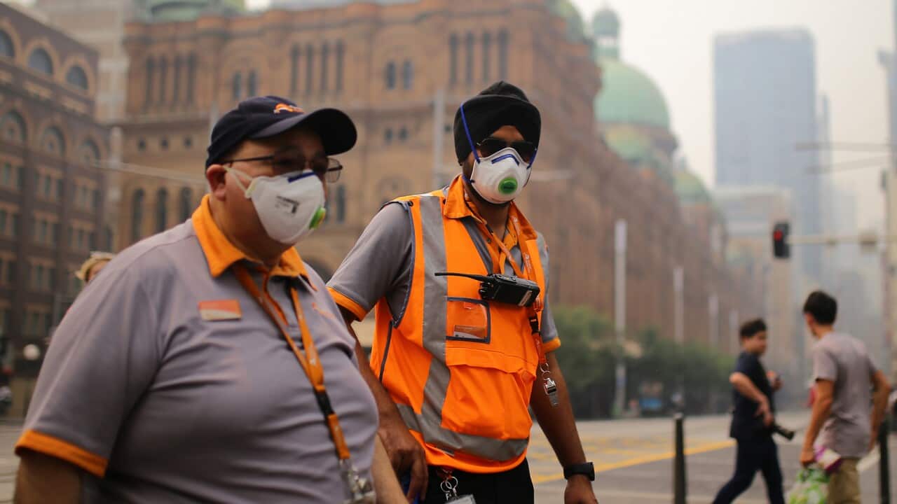 Transport NSW workers wear masks as smoke haze from bushfires blankets Sydney