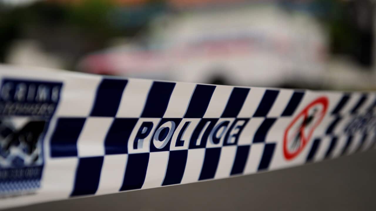 Police tape restricts access to a street in Sydney