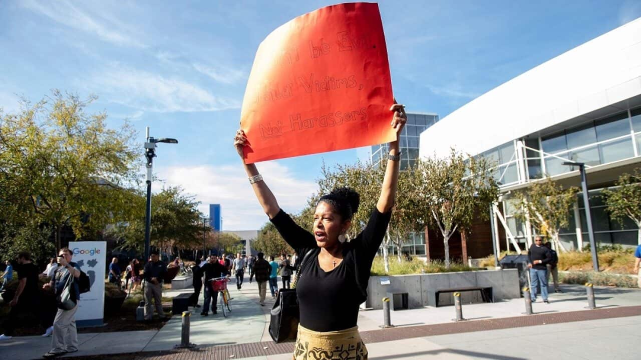Google employee Kiwoba Allaire protests against Google's handling of sexual misconduct claims on Thursday, Nov. 1, 2018, in Mountain View, Calif. Allaire joined hundreds of workers who walked out of Google headquarters. (AP Photo/Noah Berger)