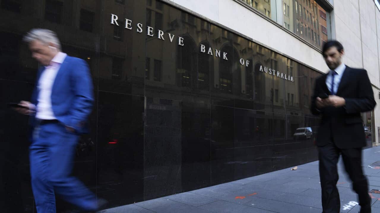 People walk past the outside of the Reserve Bank in Sydney