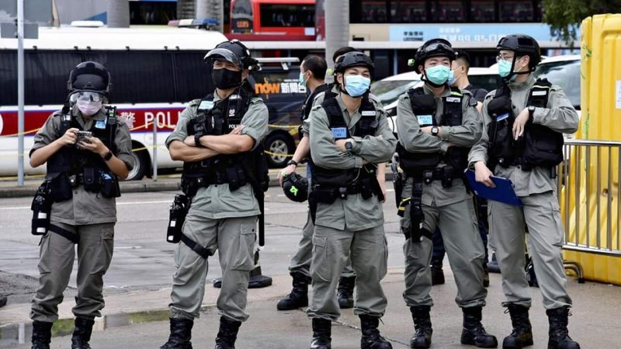 Police officers watch for demonstrations in Hong Kong